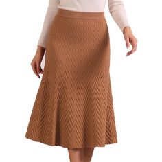 This long knit skirt features a flattering high waist design and a pull-on style, making it effortless to wear and perfect for every day or dressier occasions. The soft and cozy knit material provides warmth during cooler weather while maintaining breathability. The lettuce trim detail adds a feminine touch to the skirt, creating subtle ruffled edges along the hemline, adding a playful and trendy element to the classic silhouette, making it a versatile piece that can be dressed up or down. Relaxed Knit Skirt For Fall, Knit Relaxed Skirt For Fall, Beige Stretch Skirt For Fall, Knit Midi Skirt With Lining, Casual Knee-length Knit Bottoms, Knit Midi Skirt For Winter, Knit Lined Midi Skirt, Casual Knit Skirt For Work, Brown Stretch Skirt For Fall