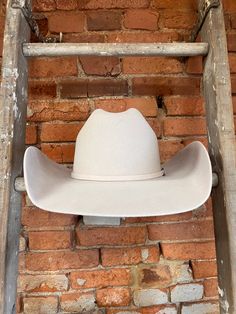 Looking for a cowboy hat that's as stylish as it is functional? Look no further than the Serratelli Mesa Cowboy Hat! Serratelli Hats are a statement piece rooted in true western heritage. With over 100 years experience, Serratelli knows how to make a cowboy hat look and feel great. Crafted from pure wool construction, this cowboy hat is designed to withstand even the toughest conditions, while keeping you looking sharp and polished. The classic Cattleman crease adds a traditional touch, while th