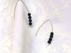 "Simple modern black onyx earrings! Handcrafted earrings made from 14k Gold Filled or 925 sterling silver wire! Elegant V shape hand crafted earrings adorned with black onyx round stones! - 14k Gold Filled (not plated) or 925 Sterling Silver wire (20gauge) - Black Onyx 4mm - Earring length is approx. 37mm = 1 1/2\" - Comes in a cute little organza bag! - If you prefer a gift box, ready for gift giving, please browse here: https://www.etsy.com/listing/248159830/cute-gift-box?ref=shop_home_active_ Modern Black Earrings For Anniversary, Handmade Black Earrings For Anniversary, Minimalist Black Earrings For Anniversary, Black Linear Earrings For Pierced Ears As Gift, Minimalist Onyx Round Bead Jewelry, Elegant Black Sterling Silver Hoop Earrings, Black Faceted Bead Earrings For Gift, Minimalist Black Sterling Silver Earrings, Modern Onyx Earrings With Black Enamel