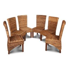 a set of four chairs made out of wicker