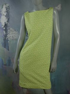 This 1960s Swedish vintage shift dress has a delicate yellow floral pattern on a mint green background. The sleeveless slip-on dress has a square bateau neckline and a green polyester lining. Bust = 37 inches (93.98cm) Waist = 37 inches (93.98cm) Hips = 37 inches (93.98cm) Dress Length = 35.5 inches (90.17cm) Brand label: Ajco (Made in Sweden) Size: 6/8 US/UK Material: Diolen Polyester Condition: Excellent (clean, soft, and supple, with no stains, tears, wear spots, or weaknesses in the seams) - Vintage Green Square Neck Dress, Retro Green Square Neck Dress, Vintage Light Green Dress For Spring, 1960s Shift Dress, Vintage Shift Dress, Silver Evening Dress, Mint Green Background, Country Dresses, Sleeveless Dress Summer