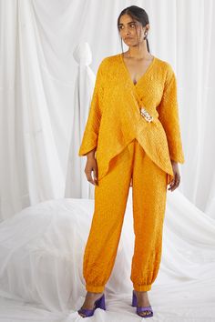 Featuring a yellow rabari tulip dhoti pants in modal satin base. This contains only one piece. . #perniaspopupshop #whatiworewastrending #ppuslove #dhotipants Tulip Dhoti, Isha Gupta, Wrap Over Top, Yellow Kimono, Silk Wrap Top, Top Satin, Embroidered Kimono, Dhoti Pants, Yellow Satin