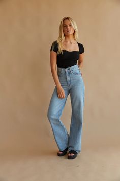 Elevate any outfit with the Levi's Ribcage Wide Leg Jeans in Far and Wide! These classic jeans are made of sturdy cotton denim and feature a super high rise fit, 5-pocket styling, belt loops, and a button fly with a branded top button closure. Pair with the  to complete the look!Details95% Cotton, 5% Recycled CottonSuper high rise: 12"Inseam: 32''Leg opening: 22''Non-stretchRecycled cottonImportedWash your jeans once every 10 wears at most; this increases their lifespan and saves natural resources.Machine wash cold / Do not bleach / Tumble dry medium / Hot iron if needed / Dry cleaning possible / Wash inside out with like colors Light Wash Wide Leg Jeans, Levi's Ribcage, Levis Ribcage, American Threads, Hot Iron, Classic Jeans, Rib Cage, Wide Leg Jeans, Say Hello