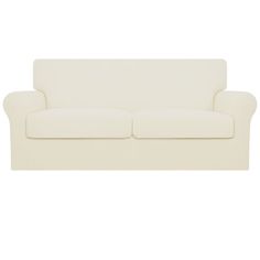 a white couch sitting on top of a white floor