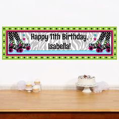 a birthday banner on a table with cupcakes