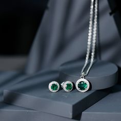 Product Details For those in search of a sophisticated and eye-catching office wear accessory, look no further than this Created Emerald Jewelry Set. Featuring a stunning Round Cut Created Emerald and Zircon in a Halo Style, this gold set is sure to make a statement. Product Information SKU SHP-PENDANT122040744 Length 18.5 mm Width 12 mm Weight 4.88 gm (Approximate) LAB CREATED EMERALD INFORMATION No.of Stones 3 Pieces Total Weight 3.78 Carat (Approximate) Dimension(approx) Round-6X6 mm-2 PcsRound-8X8 mm-1 Pcs Color Green Cut Brilliant Shape Round Setting Type Prong-Setting Quality Grade AAAA ZIRCON INFORMATION No.of Stones 56 Pieces Total Weight 0.99 Carat (Approximate) Dimension(approx) Round-1.20X1.20 mm-36 PcsRound-1.40X1.40 mm-20 Pcs Color White Cut Brilliant Shape Round Setting Type Elegant Green Jewelry With Halo Design, Elegant Green Jewelry With Halo, Elegant Green Halo Jewelry, Green Emerald Jewelry With Halo Detail, Green Emerald Halo Jewelry, Fine Jewelry Green Halo Earrings, Halo Green Fine Jewelry Earrings, Green Halo Earrings Fine Jewelry, Elegant Green Halo Earrings