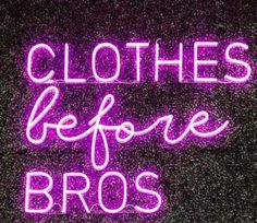 a neon sign that says clothes before bros