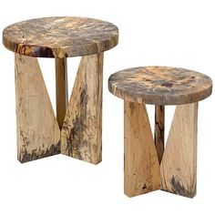 two wooden stools sitting next to each other