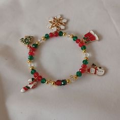 a bracelet with christmas decorations on it