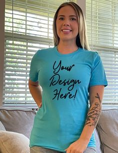 a woman wearing a t - shirt with the words your design here written on it