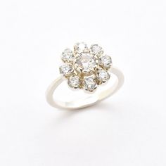 a white gold and diamond cluster ring