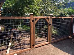 a wooden fence with metal bars on top