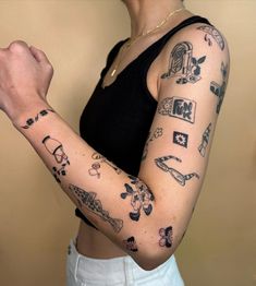 a woman with many tattoos on her arm