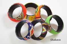 African tribal beaded bracelets African jewelry handmade bangles multicolored bangles African fashion tribal bracelets accessories gift PRODUCT SPECIFICATIONS: Bracelet inner diameter - 7.0 cm Colors - multiple colors Materials - beads, plastic tube ADDITIONAL INFORMATION New and unworn: Yes Handmade in Kenya: Yes Other jewelry in my shop: https://www.etsy.com/shop/shakava Traditional Round Beaded Bracelets For Festival, Bohemian Multicolor Bracelets For Festivals, Multicolor Bohemian Bracelets For Festivals, Multicolor Bohemian Bracelet For Festivals, Traditional Adjustable Multicolor Bangle, Multicolor Beaded Bangle For Festival, Adjustable Multicolor Artisan Bangle, Multicolor Cuff Bracelet For Festivals And Gifts, Adjustable Artisan Multicolor Bangle