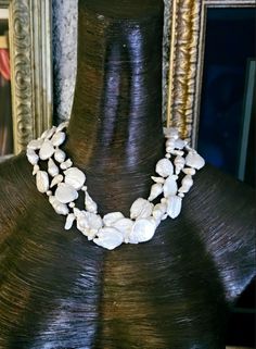 Here's an ornate vintage freshwater pearl necklace that has never been worn. I found this while organizing my jewelry and decided it was time to let someone else share the joy. Three strands of white to off-white freshwater pearls are individually knotted in this non-adjustable 19" necklace. The nacre is pristine as are the beads. This closes with an ornate carved flower abalone box clasp. Would be great for black tie, bridal or wedding venues, but it also is appropriate for business or professi White Single Strand Mother Of Pearl Necklace, Costume Jewelry Pearl Necklace With Pearl Pendant, White Mother Of Pearl Necklace With Pearl Drop, Costume Jewelry Pearl Drop Necklace For Gifts, White Pearl Drop Necklace In Mother Of Pearl, Costume Jewelry Pearl Necklace As Gift, Costume Jewelry Pearl Necklace For Gift, Costume Jewelry Pearl Necklace Gift, Costume Pearl Necklace For Gifts