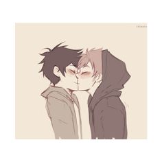 two people kissing each other while wearing hoodies