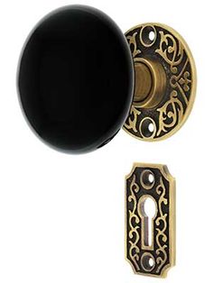 an ornate door knob with a black cover