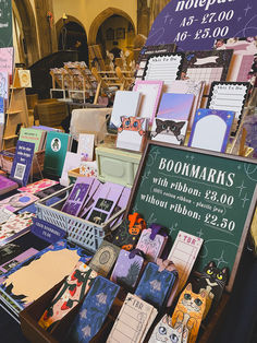 there are many books on display at the book market with price tags attached to them