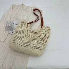 Step into summer with our Elegant Boho Summer Woven Tote Bag. This stylish shoulder bag combines bohemian elegance with practical design, making it perfect for versatile occasions. Crafted from high-quality milk cotton with an organic cotton lining, it offers a lightweight and breathable fit. The intricate knitting pattern and rivet decoration add a touch of sophistication, while the spacious interior and multiple pockets ensure you can carry all your essentials securely. Ideal for beach outings Woven Beach Bags, Boho Tote, Woven Tote Bag, Beach Collection, Stylish Shoulder Bag, Pullover Windbreaker, Practical Design, Shopping Tote Bag, Boho Summer