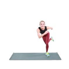 a woman in red leggings and black shirt doing a yoga pose