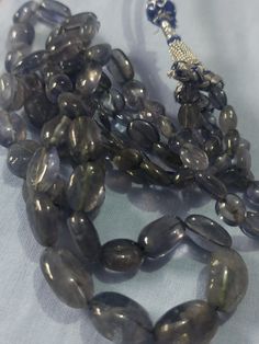 19 Inch AAA 351 Carat Natural Iolite Smooth Oval 6x8-11x17mm Beads Gemstone NecklaceWith Adjustable Code Necklace Stone - Natural Iolite 1. Weight - 351 Carat, 19 INCH, Size - 6x8-11x17mm Shape :- Oval Polish :- Handmade Purity :- 100% Natural Gemstone color - blue Rose Quartz is also the most powerful protector of the mineral kingdom, creating a shielding force throughout the aura and strengthening natural energies from within. It protects against the negativity and misfortunes of this world, a Oval Faceted Beads For Jewelry Making, Oval Natural Stone Beads For Gifts, Oval Stone Beads For Jewelry Making, Natural Oval Beads Gemstones For Jewelry Making, Natural Stone Oval Beads For Jewelry Making, Spiritual Oval Beaded Necklace With Gemstone Beads, Spiritual Oval Gemstone Beads, Oval Natural Stones For Jewelry Making, Oval Stones For Jewelry Making