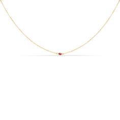 Description Layer on the glamour with our Single Stone Ruby Necklace. This elegant piece features a ruby solitaire set in your choice of 14K white gold, 14K yellow gold, or 14K rose gold. The simple and classic design is perfect for any occasion, whether you're dressing up for a night out or wearing it as an everyday accessory. The pinkish red ruby is said to symbolize passion and love. The ruby is the July birthstone, making this necklace the perfect gift idea for someone with a July birthday. All of our necklaces come with a delicate chain that can be adjusted to your desired length. Product details Below are the details of our Stone Ruby Necklace. Please reach out if you have any questions. Metal type: 14k solid gold (yellow gold, white gold, or rose gold) Gemstone: Genuine ruby Cut: Ro Classic Red 14k Gold Necklace, Classic Ruby Necklace With Diamond Cut, Classic Yellow Gold Birthstone Necklace With Delicate Chain, Classic Ruby Necklace In Yellow Gold, Elegant 14k Gold Birthstone Necklace With Briolette Shape, 14k Gold Solitaire Necklace Fine Jewelry, Fine Jewelry Birthstone Necklace With Delicate Chain, Elegant Ruby Briolette Necklace, Elegant Yellow Gold Birthstone Necklace With Single Diamond