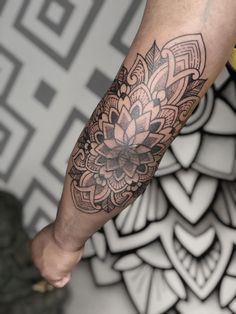 a person with a flower tattoo on their arm