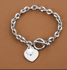 Stylish silver chain link charm heart bracelet  Great gift for birthday, anniversary, child, friend, and any occasion  Built for durability and long lasting wear. Trendy Silver Heart Bracelet For Friendship, Trendy Silver Heart Bracelet For Gift, Trendy Silver Chain Bracelets For Gifts, Trendy Metal Heart Bracelet As A Gift, Silver Heart Charm Bracelet For Friendship, Trendy Personalized Silver Heart Bracelet, Silver Heart-shaped Chain Bracelet, Trendy Heart Charm Chain Bracelet For Valentine's Day, Trendy Chain Bracelet With Heart Charm For Valentine's Day