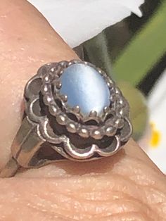 Vintage antique sterling silver light blue cats like glass cabochon ? This ring is really nice, it is an unusual make, it is adjustable by one side sliding into the top of the rain and back out so it adjusts from approximately 7 to size 8 please see photos as the band is slightly out of shape but it does not affect the feel of the ring at all. I am not sure if this is glass cat's-eye or a light blue gemstone it is slightly mottled at the top which you cannot see unless you look up very close. Th Light Blue Gemstone, Silver Lights, Out Of Shape, Cabochon Ring, Blue Cats, Blue Gemstones, Rings Statement, Vintage Antiques, Statement Rings