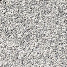 a close up view of a gray carpet textured with small white dots on it