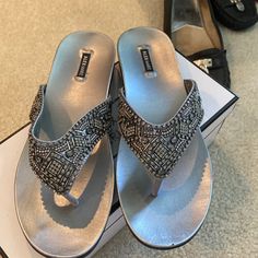 Brand New, Never Worn Sandals. Color Is Silver/Grey With Beading. Box Included May Not Match Style Tag, But Matches Brand Silver Toe Post Sandals With Rhinestones, Silver Rhinestone Toe Post Sandals, Silver Embellished Toe Post Sandals, Silver Embellished Flat Sandals, Embellished Silver Sandals For Summer, Summer Embellished Silver Sandals, Alex Marie, Thong Sandals, Women's Shoes Sandals