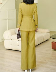 This elegant mustard pantsuit comes with a waist-sash blazer and flare-bottom pants for a sophisticated aesthetic that can be styled in endless ways. Black trim on collars and sleeves Blazer: Lined, double-breasted button closure Blazer: Long sleeves, shawl collar, front flap pockets Pants: Zip fly with hook-and-button closure Pants: Front slant pockets 50% wool,50% polyester Dry Clean Item #2816 Women's blazer & pant two-piece set SIZE INFO XS=US2=UK6=EU32 S=US4-6=UK8-10=EU34-36 M=US8-10=UK12-1 Beige Long Sleeve Suits For Fall, Beige Long Sleeve Suits For Spring, Tailored Beige Wool Coat With Long Sleeves, Tailored Beige Tweed Jacket, Tailored Long Sleeve Beige Tweed Jacket, Tailored Beige Tweed Jacket With Long Sleeves, Solid Long Sleeve Suits For Fall, Beige Wool Long Sleeve Suit, Cream Long Sleeve Outerwear For Tailoring