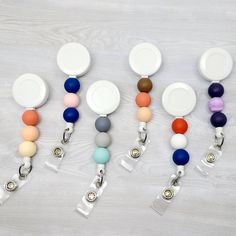 "This PERSONALIZED badge reel is just the thing you're looking for! It is made with a combination of silicone beads that have been permanently attached to this retractable badge reel. A variety of colors to choose from!! MAKE SURE TO INCLUDE A NOTE TO THE SELLER WITH YOUR BEAD COLOR AND ORDER. **ONLY INCLUDE THE NUMBER ASSOCIATED WITH THE BEAD AND NOT THE COLOR** EXAMPLES: (BEAD 1, 12, 20) (TOP BEAD 1, MIDDLE BEAD 12, BOTTOM BEAD 20) **These reels are personalized to order and therefore cannot b Bead Badge Reel, Mini Sharpie, Beaded Badge Reel, Owl Sewing, Personalised Badges, Pen Gift, Nurse Badge, Retractable Badge Reel, Doctor Medical