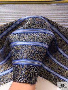 SKU: 15768 Content: 100% Silk Color: Navy / Blue / Yellow / Tan Width: 39 inches Blue Paisley Print Suit And Tie Accessories, Luxury Blue Silk Ties, Elegant Blue Fabric For Formal Occasions, Elegant Blue Formal Fabric, Formal Blue Silk Neckwear, Blue Silk Neckwear For Formal Occasions, Elegant Patterned Silk Fabric, Fitted Elegant Business Fabric, Blue Silk Neckwear With Ties