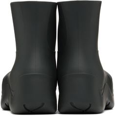 Ankle-high waterproof biodegradable rubber boots in black. · Bonded jersey lining · Textured rubber midsole · Treaded rubber outsole Supplier color: Camping Black Boots With Recycled Rubber Sole, Black Waterproof Boots Made Of Recycled Rubber, Black Waterproof Boots With Recycled Rubber, Black Ankle Rain Boots With Rubber Sole, Puddle Boots, Rubber Boots, Bottega Veneta, Rubber Rain Boots, Cobalt