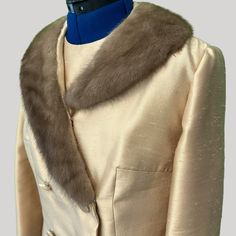 "This luxurious sheath dress with coordinating fur collar coat was designed by Bernetto, New York and sold by the Nebraska, Omaha boutique.  The sleeveless dress is fully lined and measures 27\" from underarm to hem, 36\" bust, 34\" waist, and 37\" hip. It features ecru lace insets and a 21\" back zipper. The coat fits over the dress and features a light brown (mink?) collar and fabric-covered buttons. Dress and coat are in excellent pre-owned condition and have excellent tailoring. The color is more striking in the picture with a goldish sheen." Elegant Evening Outerwear With Feather Trim, Elegant Mink Outerwear For Party, Elegant Formal Outerwear With Faux Fur Trim, Coat With Fur Collar, Coat Fits, Coat With Fur, Fur Collar Coat, Collar Coat, Fabric Covered Button