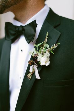 a man in a tuxedo with a boutonniere on his lapel