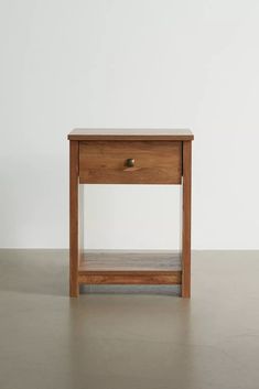 a small wooden table sitting on top of a floor