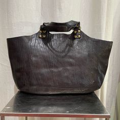 Made In Italy, Brown Leather, Comes With Longer Strap, Care Bag And Leather Cream 15 X 10 X 3 Inches Two Zipper Pockets Inside Designer Bags With Brass Hardware For Everyday Use, Designer Tote Shoulder Bag With Brass Hardware, Designer Shoulder Bag Tote With Brass Hardware, Brown Shoulder Bag With Gunmetal Hardware For Evening, Black Hobo Bag With Gunmetal Hardware And Top Handle, Black Top Handle Hobo Bag With Gunmetal Hardware, Luxury Hobo Bag With Gunmetal Hardware For Shopping, Designer Black Shoulder Bag With Leather Lining, Designer Shoulder Bag With Brass Hardware For Shopping