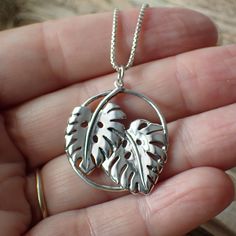 This is a beautiful detailed monstera leaf charm made from recycled sterling silver♻️that measures 32mm in length including the bail and 26mm wide. It comes on a 1mm rounded box chain in your choice of 16", 18", 20" or 24" long.Crafted with attention to detail, the open circle charm boasts a polished sterling silver surface that symbolizes the unending cycle of life and nature's eternal renewal. Nestled within this captivating embrace are two delicately etched Monstera Leaves, their intricate pa Monstera Leaves, Craft Jewelry, Round Box, Leaf Charms, Monstera Leaf, Leaf Necklace, Recycled Sterling Silver, Box Chain, Jewelry Ideas