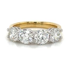 three stone diamond ring in yellow gold