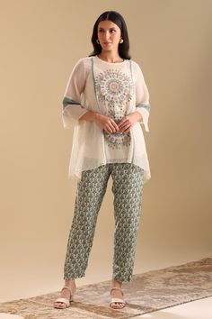 Off-white kurta with sequin, thread, french knots, bead embroidery in geometric applique pattern. Paired with inner and green floral print pant. - Aza Fashions Geometric Applique, Net Embroidery, Print Pant, White Kurta, Floral Print Pants, Flowy Design, Indian Wedding Wear, French Knots, Beaded Neckline