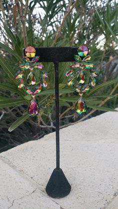 "Fun and sparkly green iridescent earrings! Color: vitrail/ green Style: pierced setting Size: .2.5\" long Need a matching bracelet? https://etsy.me/3LeGE6j Or matching ring?! https://etsy.me/3sle1v1" Iridescent Earrings, Fun Ornaments, Matching Ring, Green Style, Matching Bracelet, Earrings Green, Matching Rings, Matching Bracelets, Rhinestone Earrings