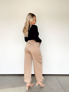 Introducing Luxe Satin Cargo Pants, the sophisticated and stylish way to upgrade your wardrobe. Crafted from luxurious satin, these pants feature a high rise, button and zipper closure, and cargo pockets for a classy, trendy look. A drawstring hem provides a perfect fit, and a neutral hue keeps it suitable for business or school. Elevate your look and become a boss babe with Luxe Satin Cargo Pants. 100% Polyester Hand wash cold. Cargo And Bodysuit Outfit, Silk Cargo Pants, Satin Cargo Pants, Cute Work Outfits, Body Suit Outfits, Brown Silk, Boss Babe, Cargo Pants, Work Outfit