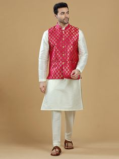 A gold zari brocade vest to pair with any kurta with statement button closures at the front. Occasion: Style this vest with pajama pants and a kurta for a welcome dinner or sangeet night, or style it with a any dress shirt and trousers for a sleek Indian wedding reception look! WASH CARE INSTRUCTIONS - Please Dry clean only. Slight color variation is possible due to digital photography. **Kurta & Pajama not included Pink Nehru Jacket For Festive Occasions, Sleeveless Bandhgala For Eid, Festive Pink Nehru Jacket Straight Kurta, Pink Nehru Jacket With Zari Work For Festive Occasions, Pink Sleeveless Traditional Wear For Eid, Pink Sleeveless Traditional Wear, Festive Sleeveless Pink Kurta, Pink Sherwani For Diwali Puja, Pink Sherwani For Puja And Diwali