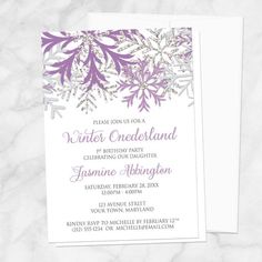 an elegant winter wedding card with snowflakes on the front and bottom, in blue