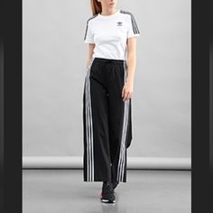 Nwt Adidas Performance W Aekn Snp Pnt Ge5490 Size Small Pull On 3 Stripe Track Joggers Sustainable Streetwear Also A Very Cool Dressy Pant W Heel By Adidas Originals 3 White Trefoil Stripes Unsnaps Up Sides With 9" To Elastic Waist /Adibreak Size: Small Womens/Unisex Waist: 28"Stretch Goes To 30" Inseam Length: Appx 30" Leg Width Bottom: Care Instructions Machine Wash Closure Type Pull On Rise Style: Mid Rise See Pix:) About This Item Sport Trousers Trendy Geek Wider Leg Sportswear Trousers Unis Adidas Athleisure Sweatpants With Side Stripes, Athleisure Sports Bottoms With Side Stripes, Sporty Joggers With Side Stripes For Jogging, Athleisure Sweatpants With Side Stripes For Sports, Sporty Pants With Side Stripes For Workout, Athleisure Bottoms With Side Stripes For Sports, Sporty Workout Pants With Side Stripes, Adidas Sweatpants With Side Stripes For Sports, Adidas Sporty Sweatpants With Moisture-wicking