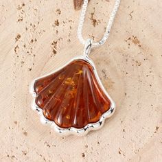 This is a wonderful pendant, ideal if you are looking for something a little different. This pendant is set with genuine carved amber. The large piece of amber measures 21 x 26 mm (including bale). and comes with a lovely 18 inch chain.See my shop for matching earrings and other amber items:https://www.etsy.com/uk/shop/gotcharm Amber Resin Pendant Necklace, Baltic Amber Pendant Necklace, Amber Pendant Necklace In Baltic Amber, Amber Pendant Necklace With Lobster Clasp, Orange Baltic Amber Pendant Jewelry, Unique Amber Necklace With Polished Finish, Orange Baltic Amber Pendant Necklace, Amber Hallmarked Necklaces For Gifts, Baltic Amber Necklace With Round Pendant