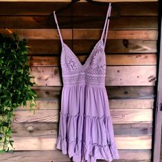 Beautiful Never Worn Mini Sun Dress Perfect For Summer. Pair With Your Favorite Cowgirl Boots Or Sandals. Tie Back With Stretchy Waist. I’m 5’10 , Hits Mid Thigh. Purple Ruffled Dress With Spaghetti Straps, Purple V-neck Sundress For Summer, Purple V-neck Sundress For Spring, Purple V-neck Spring Sundress, Purple Beach Sundress With Spaghetti Straps, Purple Sundress With Spaghetti Straps For Beach, Purple Ruffled Sundress For Summer, Purple Spaghetti Strap Sundress For Beach, Lavender Sleeveless Sundress