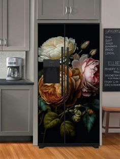 an image of a kitchen with flowers painted on the door and side by side refrigerator